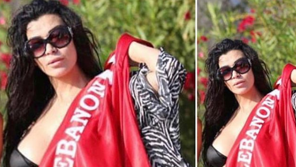 بالصور - نادين الراسي تشجع منتخبها بلبس الـ