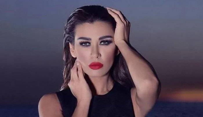 بالصور - تعرفوا الى ساندرين شقيقة نادين الراسي في إطلاقها فيديو كليب 