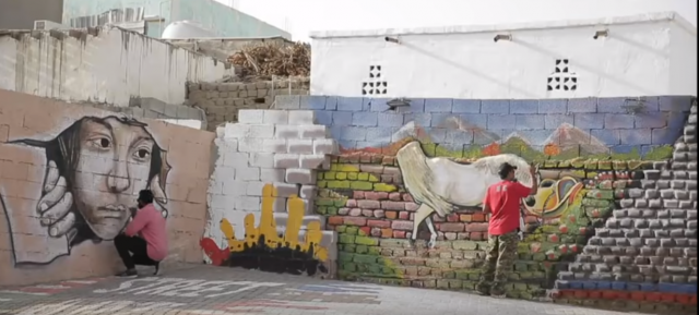 بالفيديو - شباب الشقيق يلونون أحد أحيائها