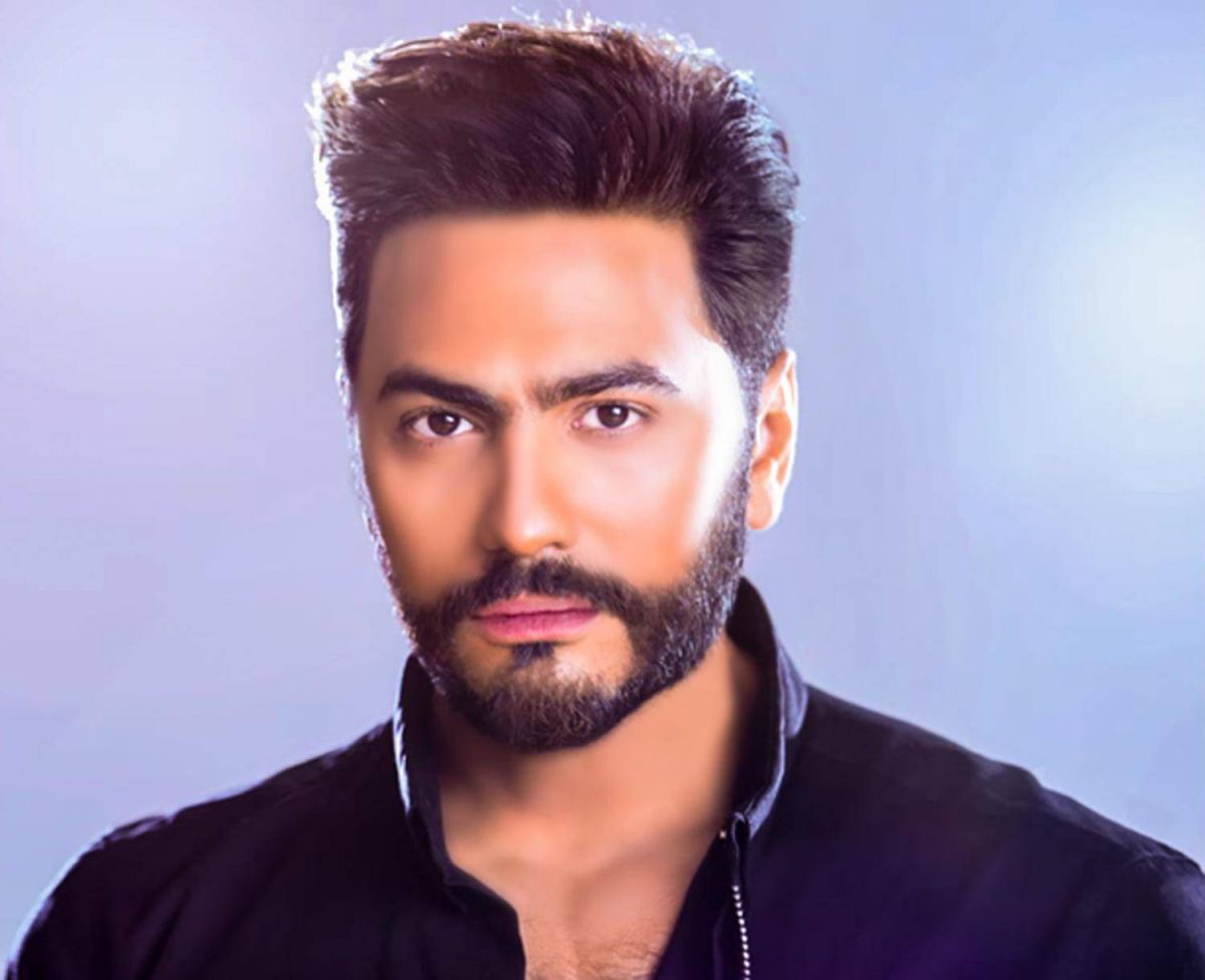 ما الذي فعله تامر حسني مع شاب مصاب بمتلازمة داون؟