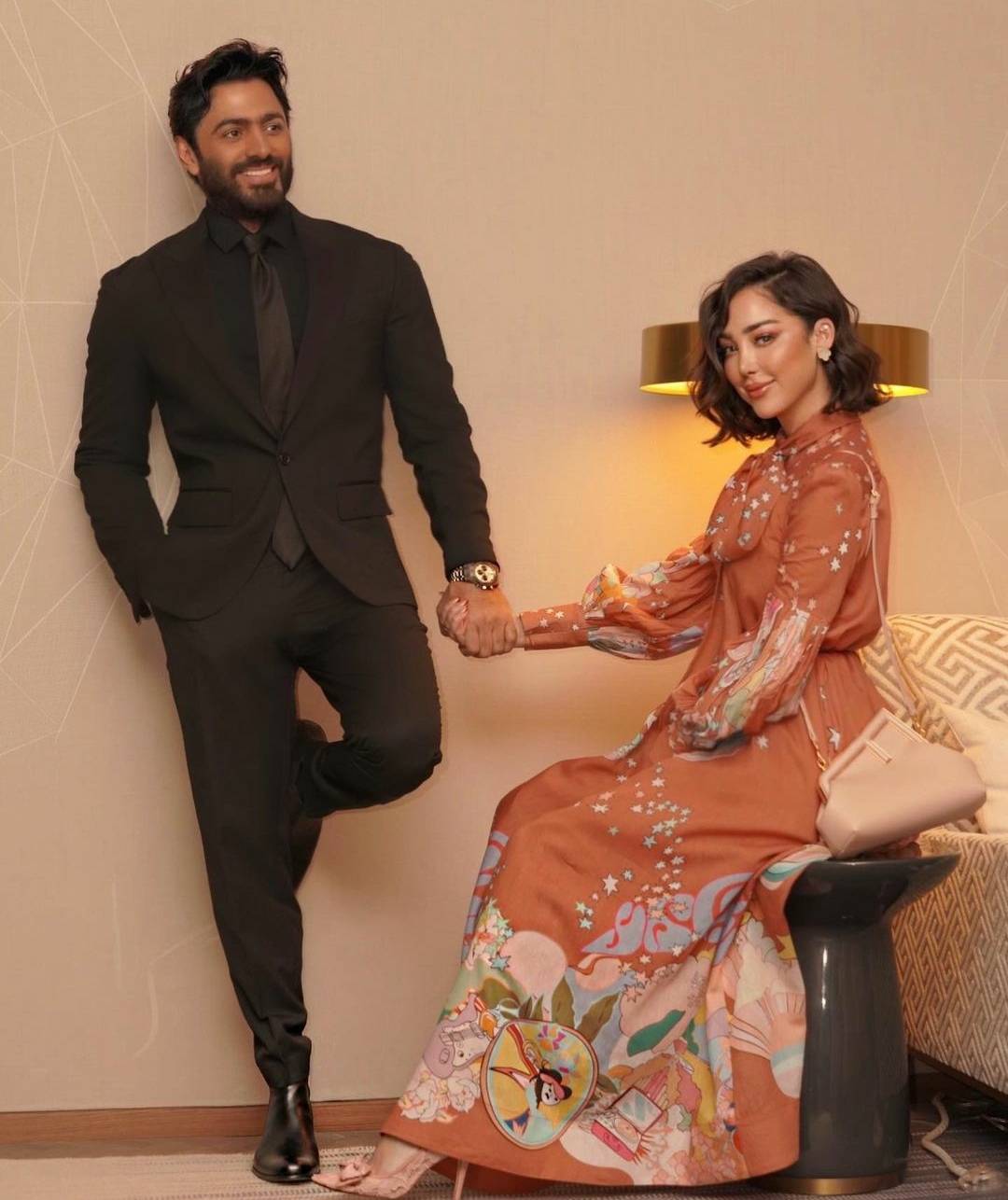 إليكِ سعر إطلالة بسمة بوسيل الأنيقة مع زوجها