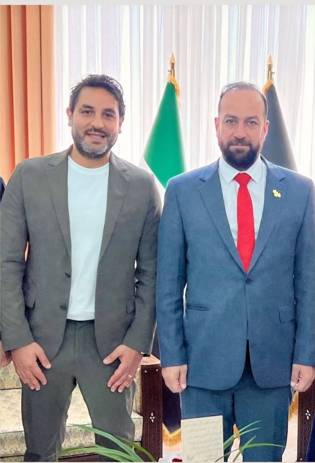 أنس نصري ووزير الإعلام السوري حمزة المصطفى