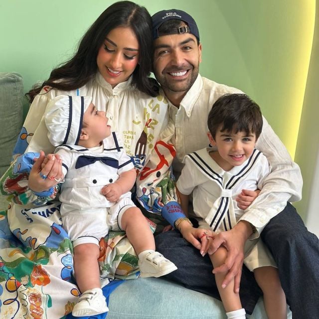عقيل الرئيسي وفرح الهادي مع طفليهما