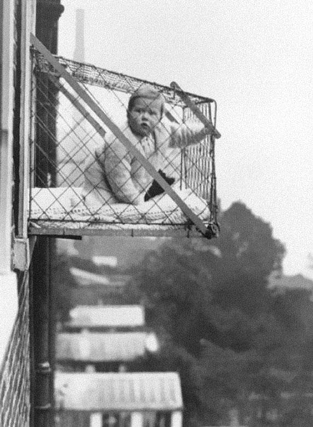 12-Baby cages used to ensure that children get enough sunlight and fresh air when living in an apartment building ca 1937