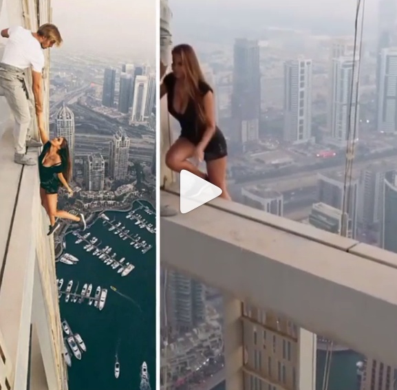 بالفيديو - شاهدوا جنون هذه العارضة الروسية في دبي.. وكيف تدلت من ناطحة سحاب!